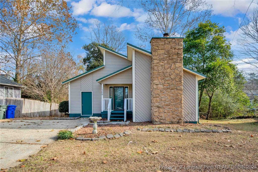 a backyard of a house with oven and yard