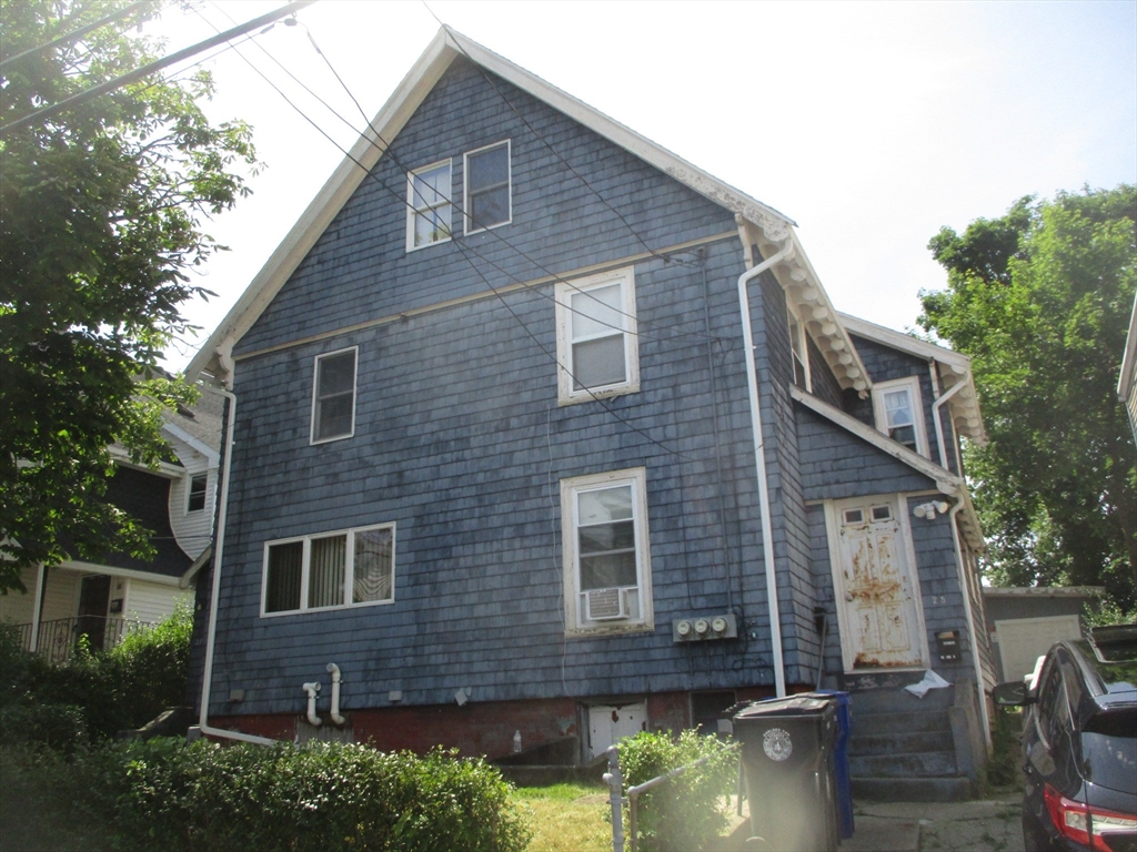 a brick house with a large windows