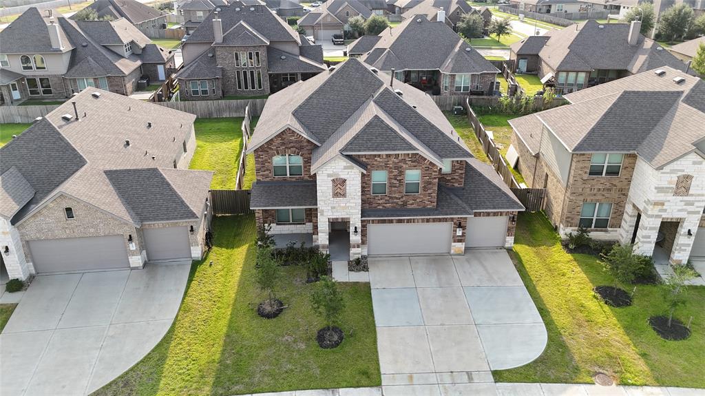 an aerial view of a house with swimming pool