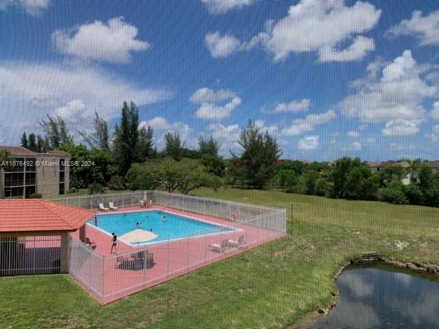 a yard with swimming pool and outdoor seating