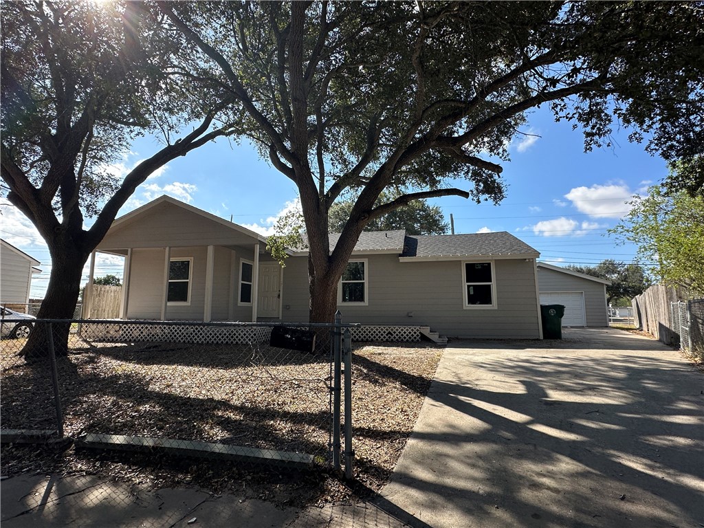 a house that has tree in front of it