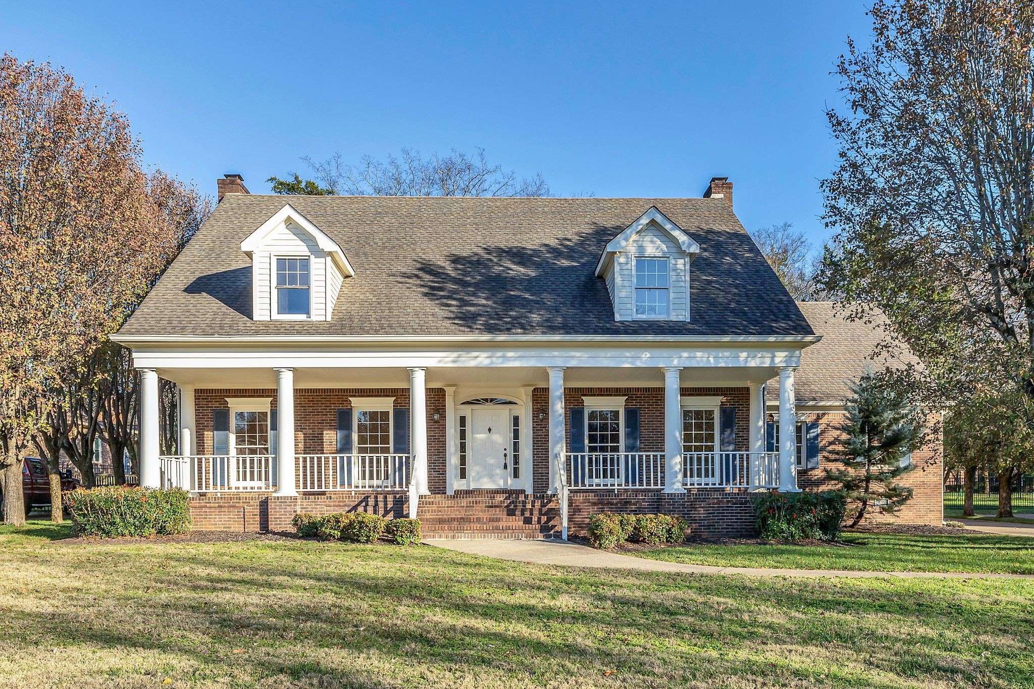 front view of a house with a yard