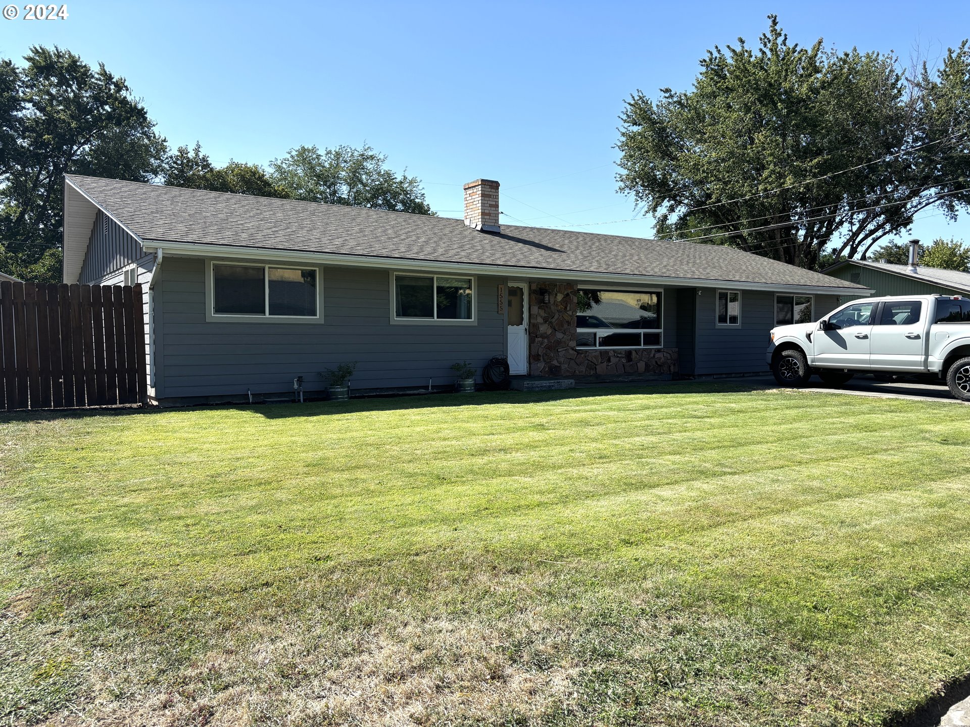 a house view with a sitting space and garden