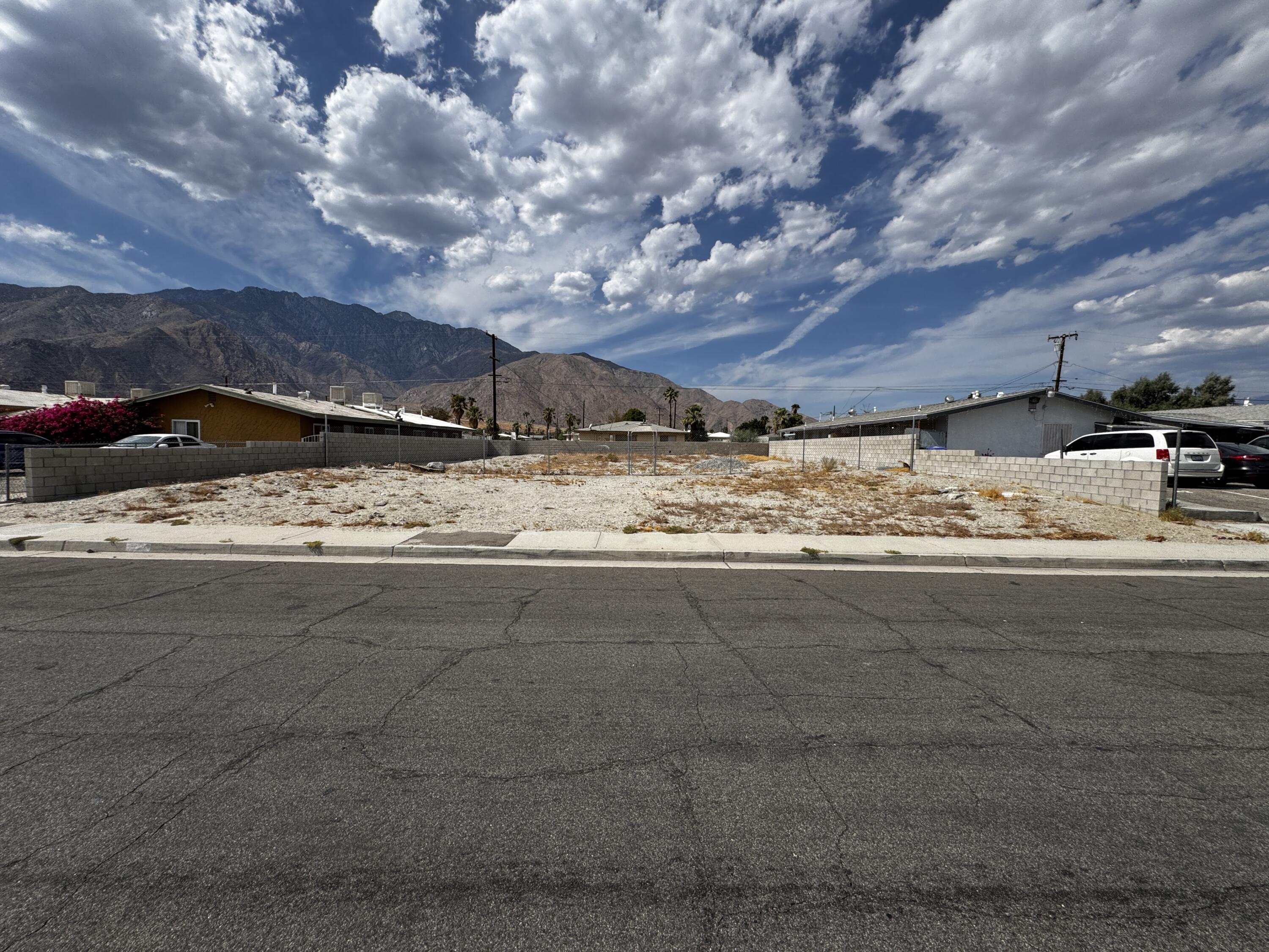 a view of a yard with car parked