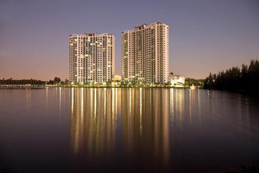 a view of swimming pool with outdoor space and lake view