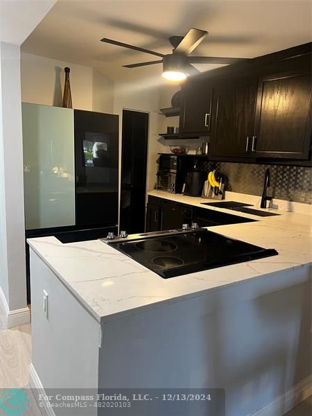 a kitchen with stainless steel appliances a refrigerator and sink