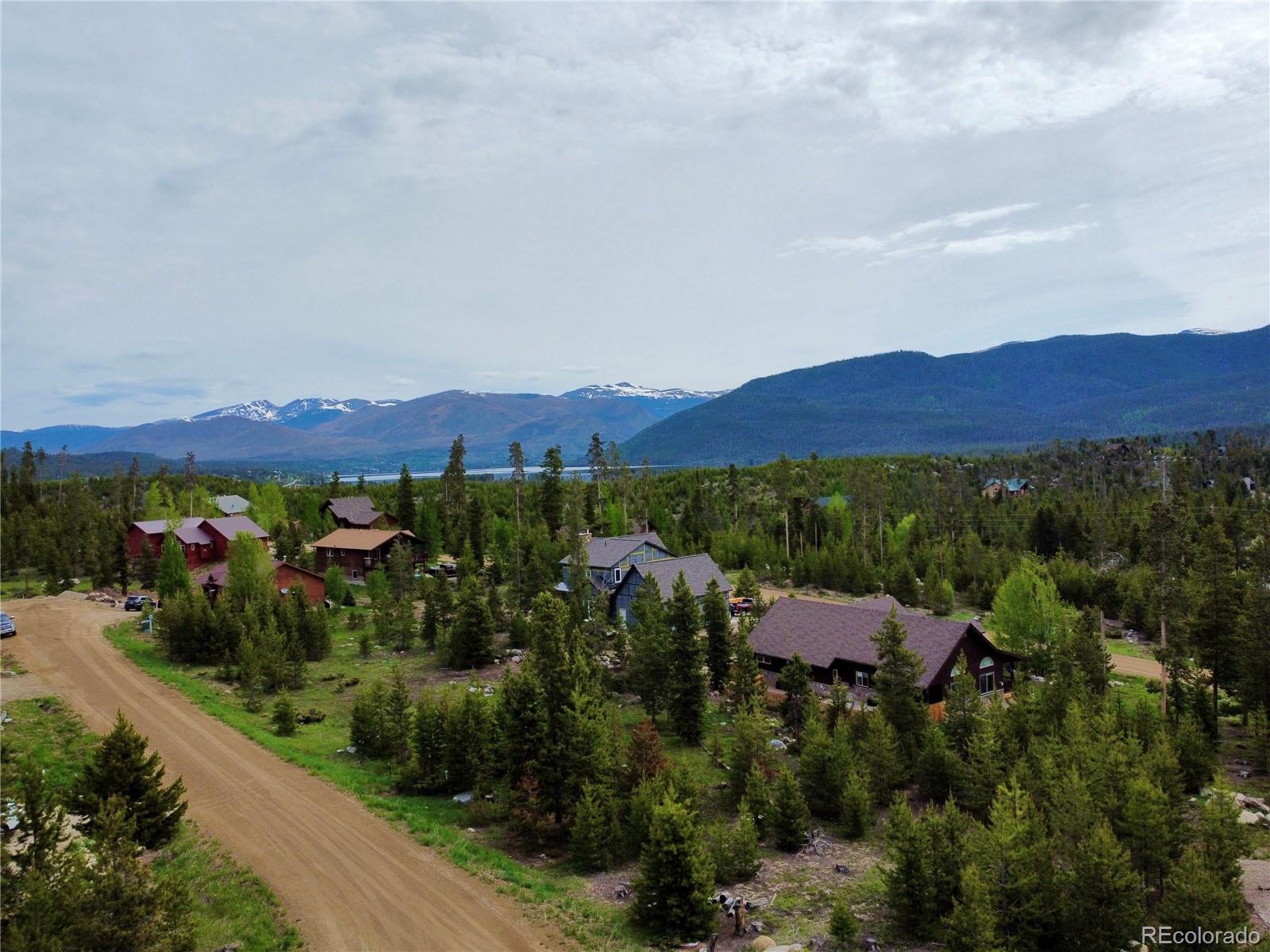 an aerial view of a and mountain in the background