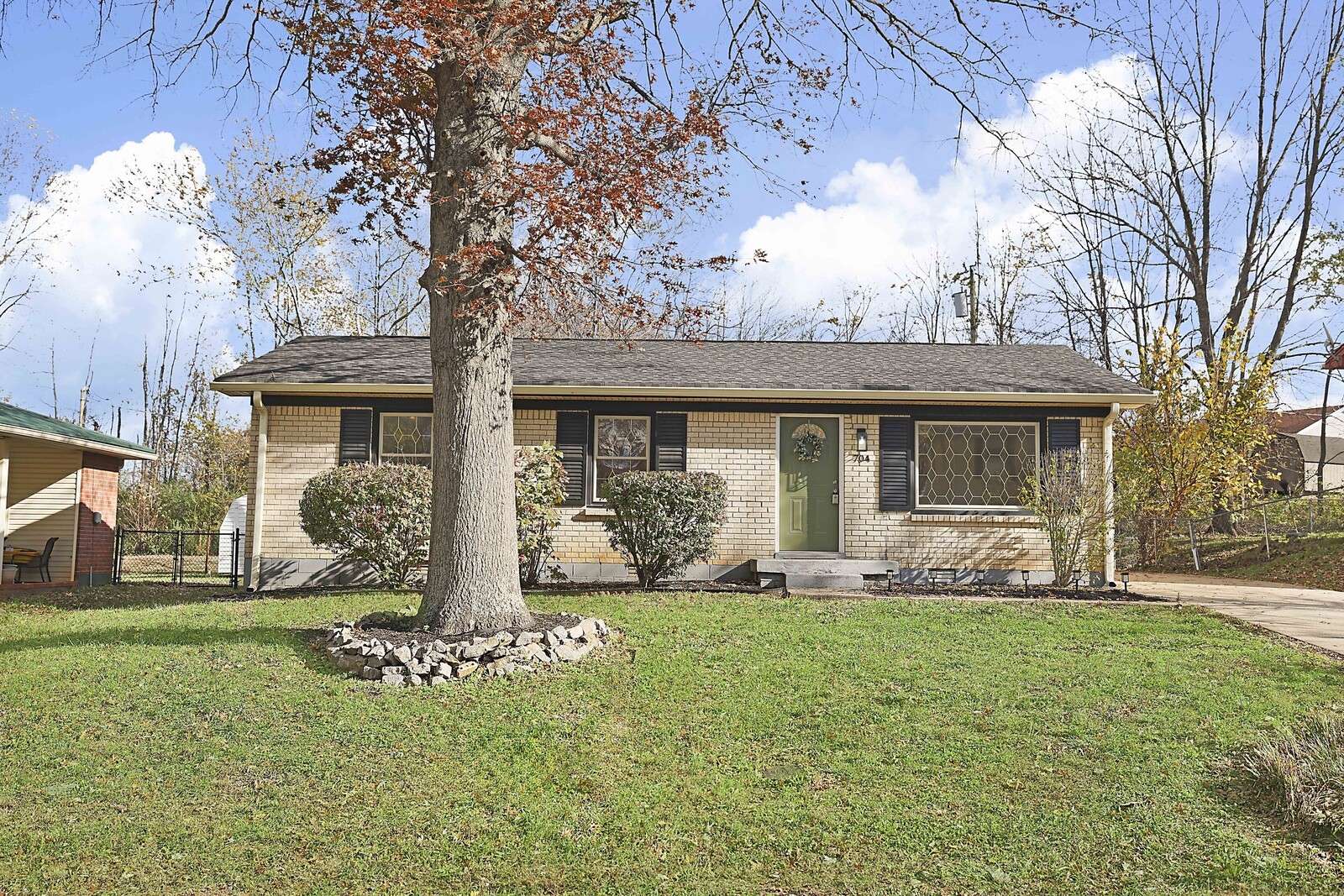 a front view of a house with garden