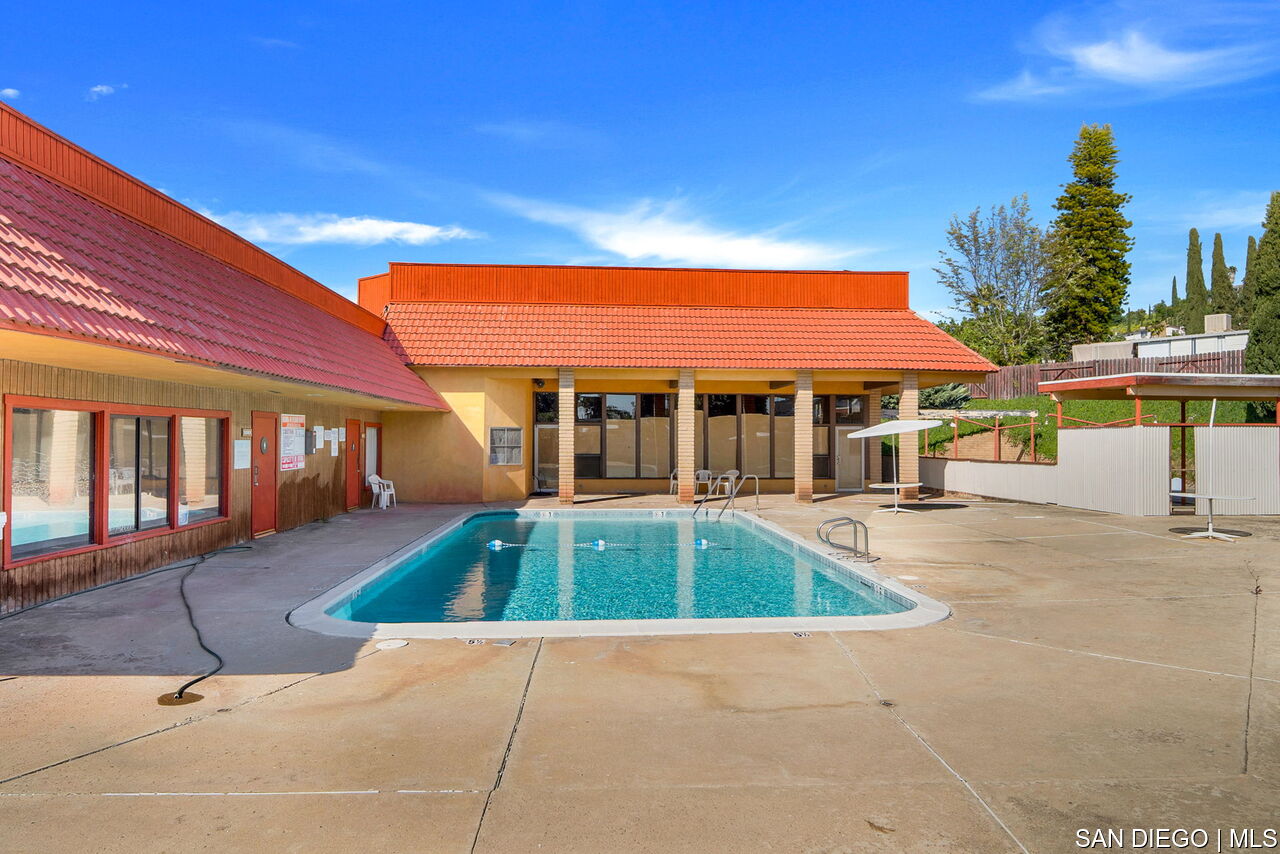 a view of a house with swimming pool