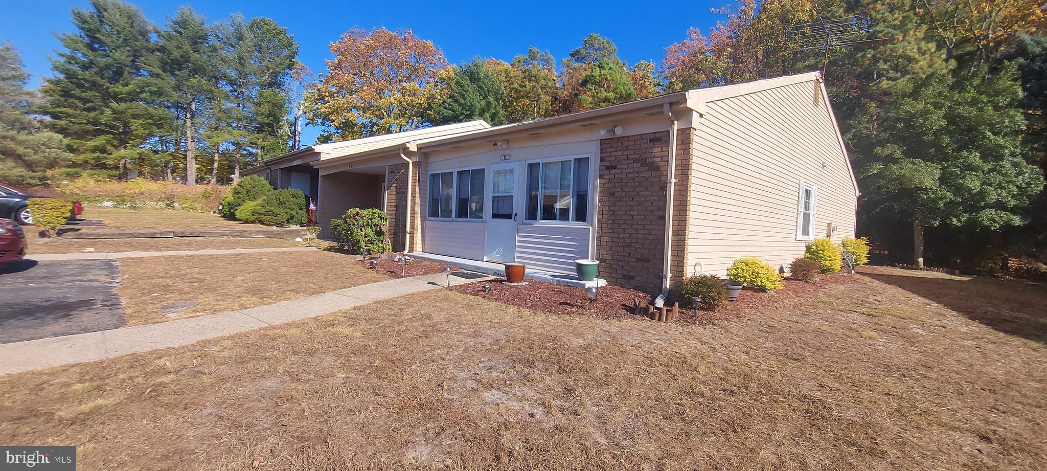 a view of a house with a yard and garage