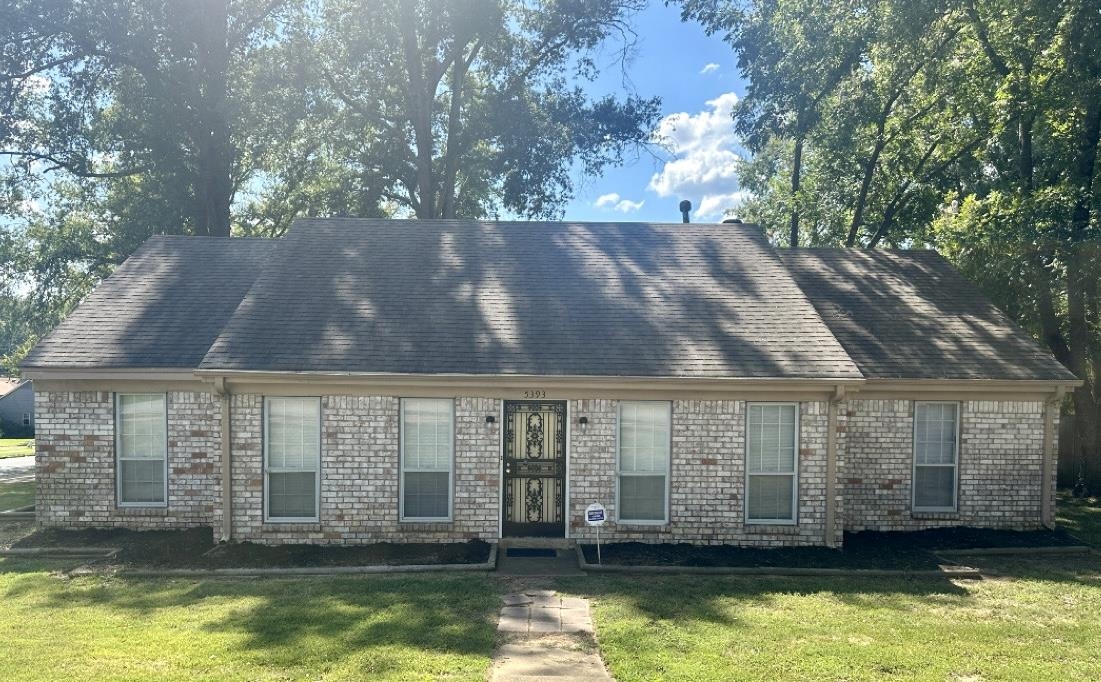 View of front of property with a front lawn