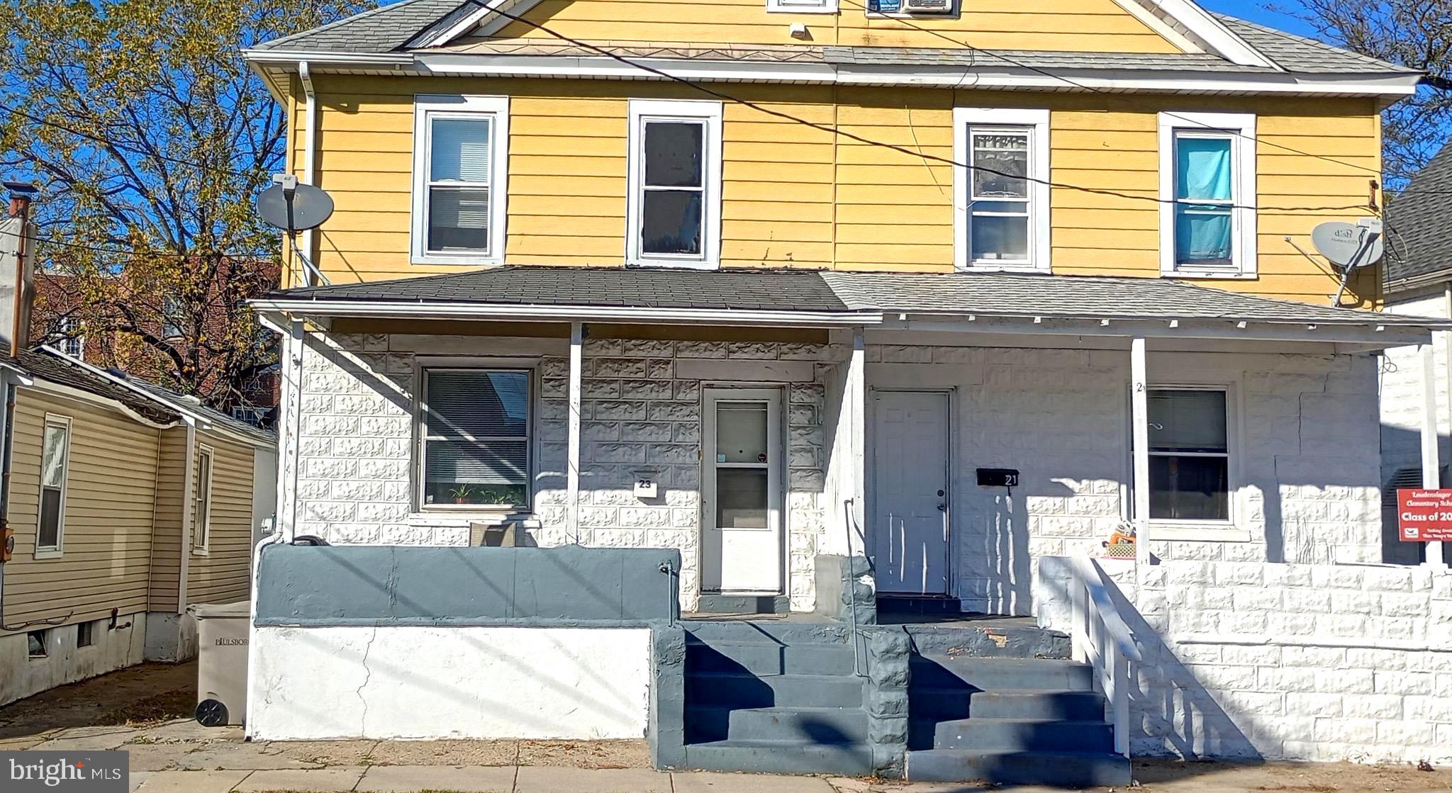 a front view of a house with a large window