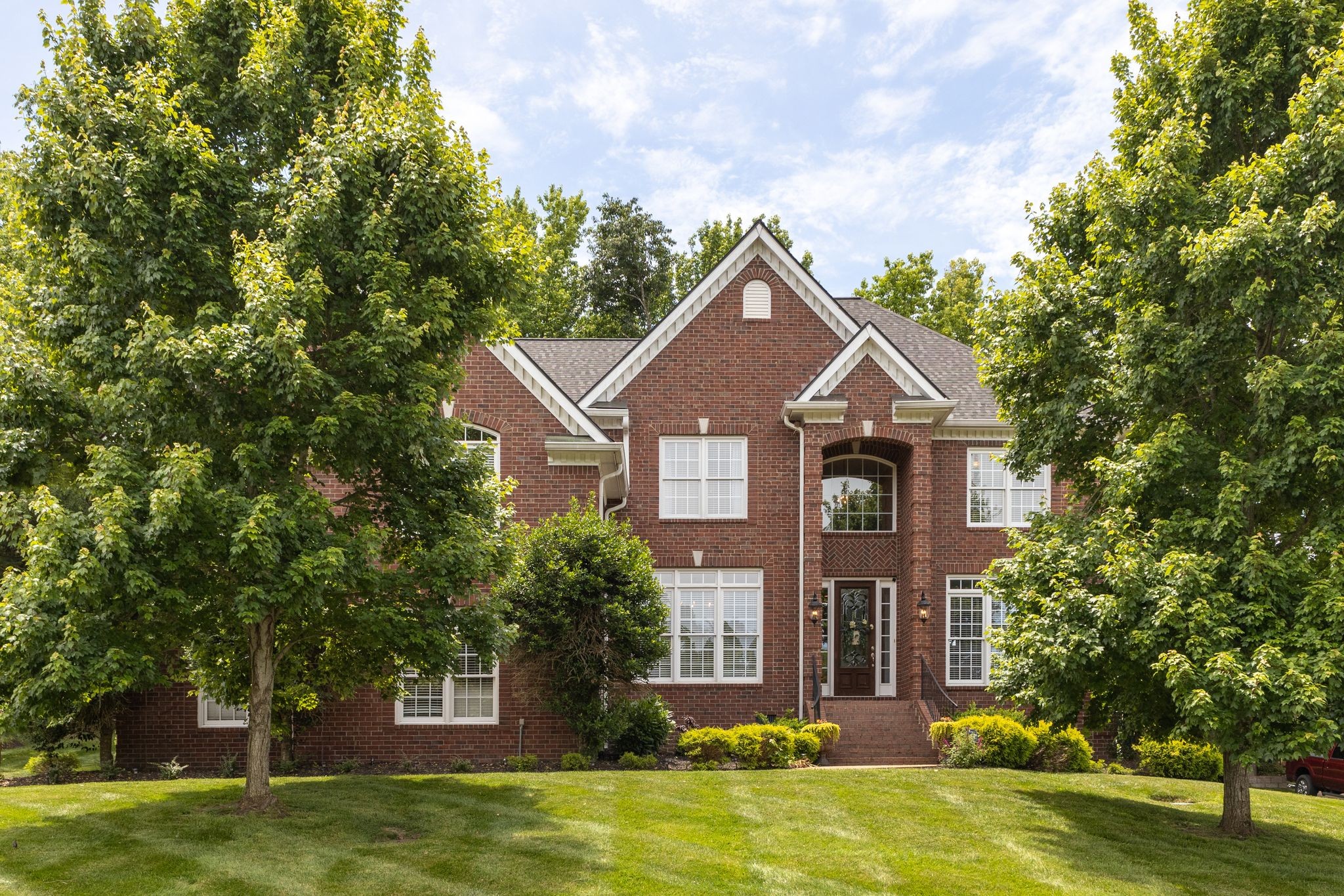 a front view of a house with a yard