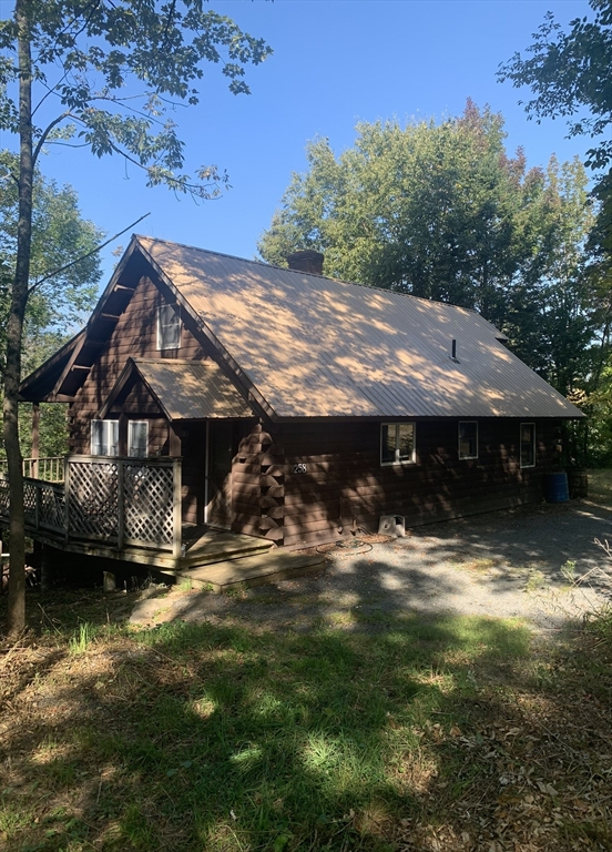 a view of house with outdoor space