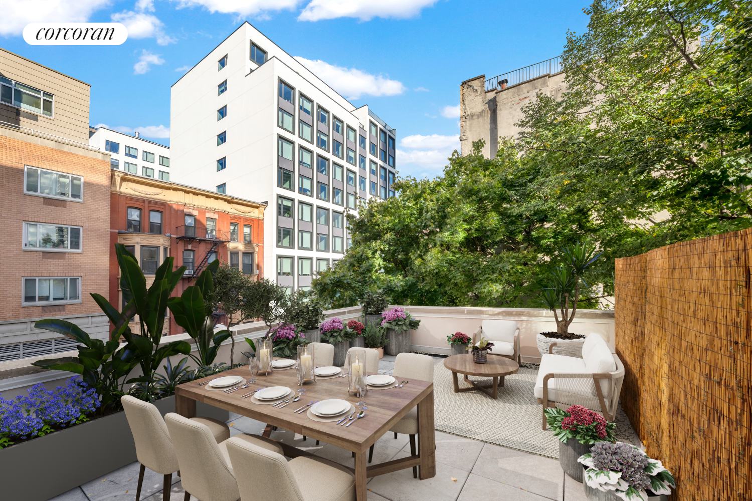 a view of a patio with couches and table and chairs and potted plants