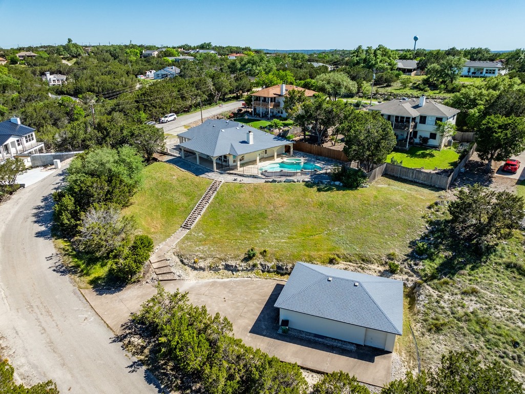 an aerial view of residential houses with outdoor space