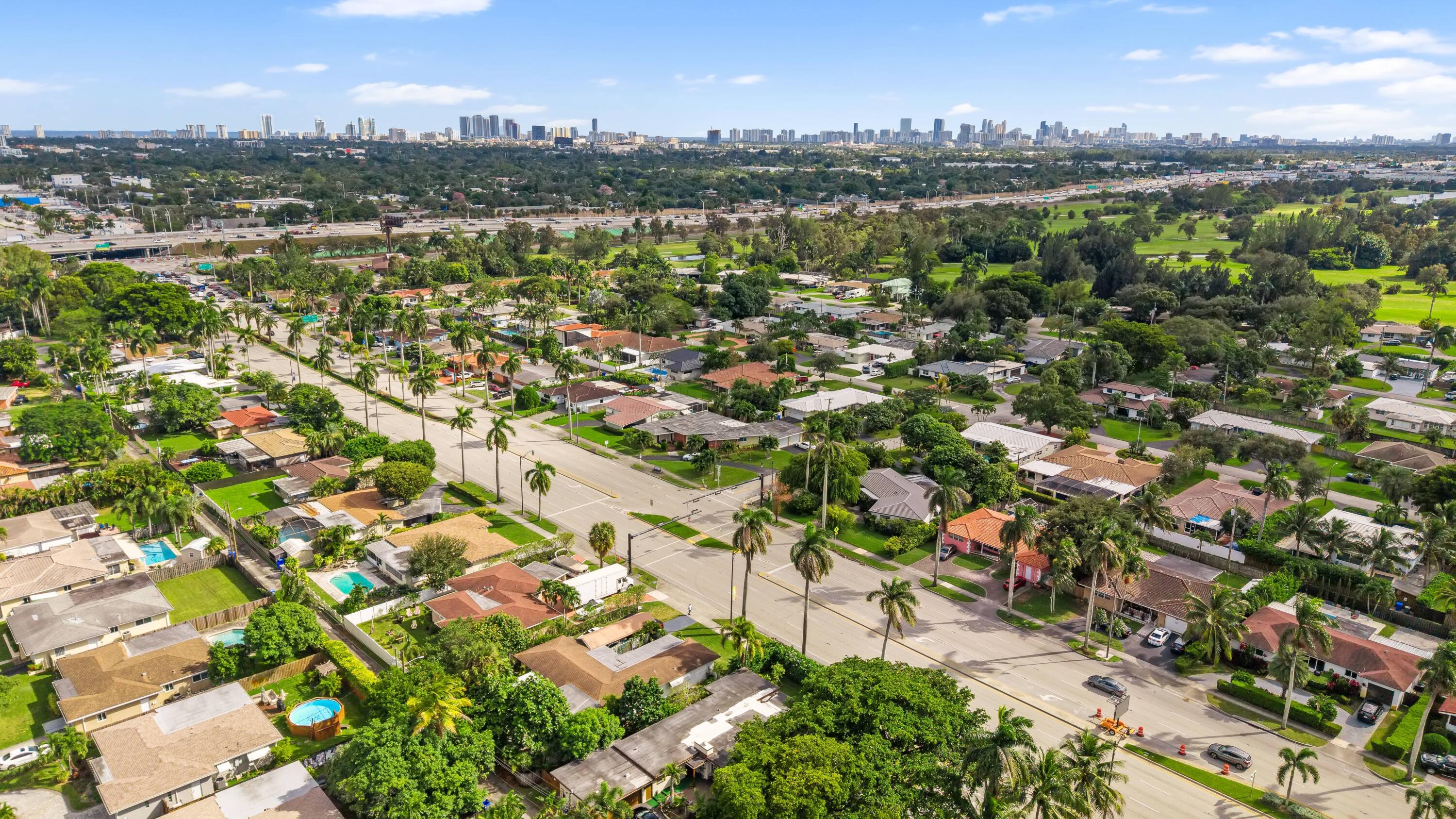 an aerial view of residential building with green space