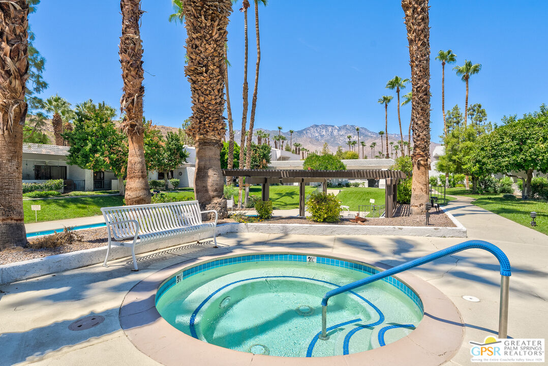 a swimming pool with outdoor seating and yard