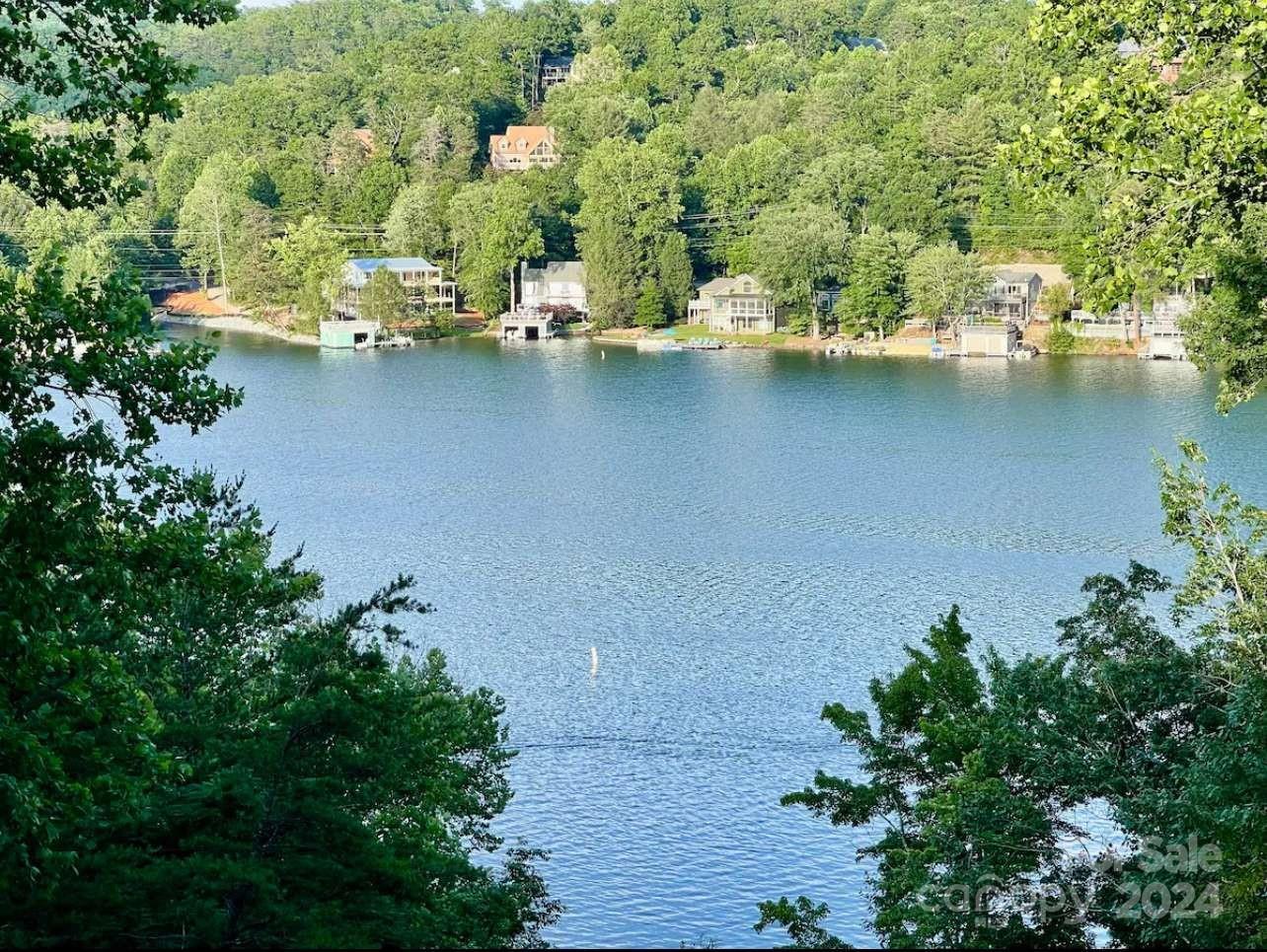 an aerial view of residential house with outdoor space and lake view