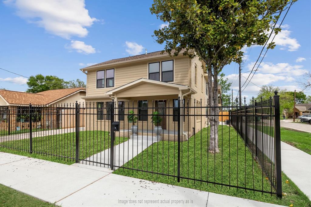 a view of a wrought iron fences in front of house