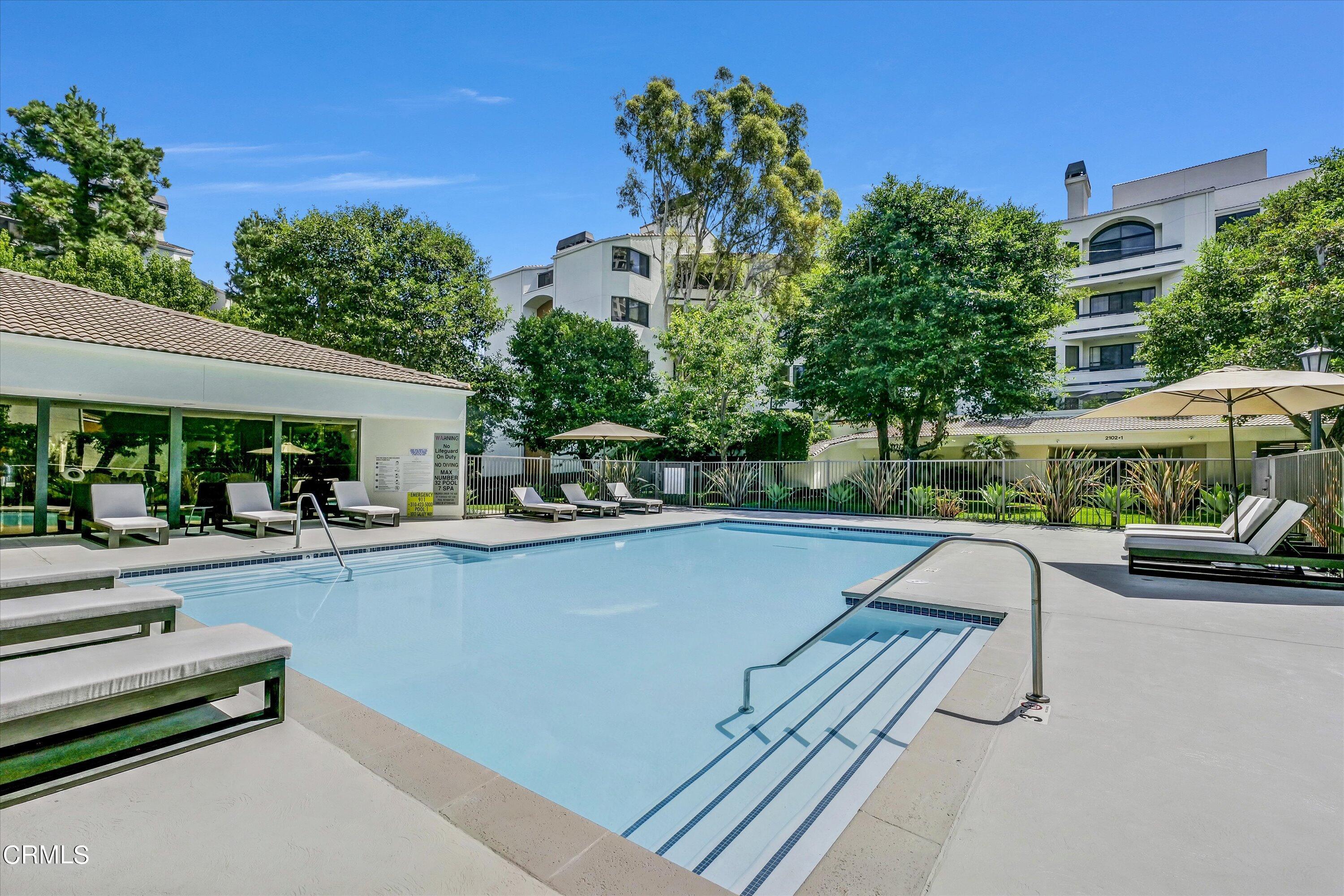 a view of a swimming pool with a patio