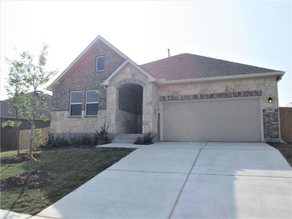 a view of a house with a back yard