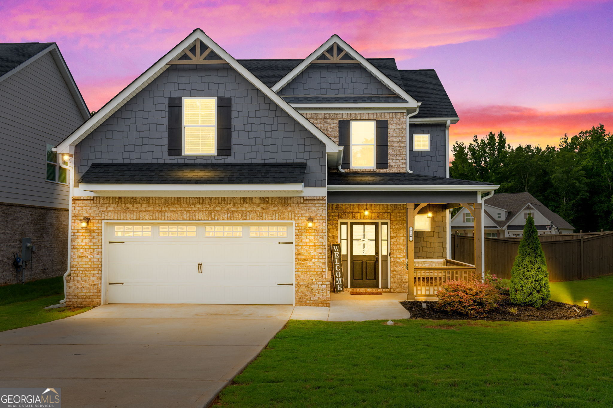 a front view of a house with a yard