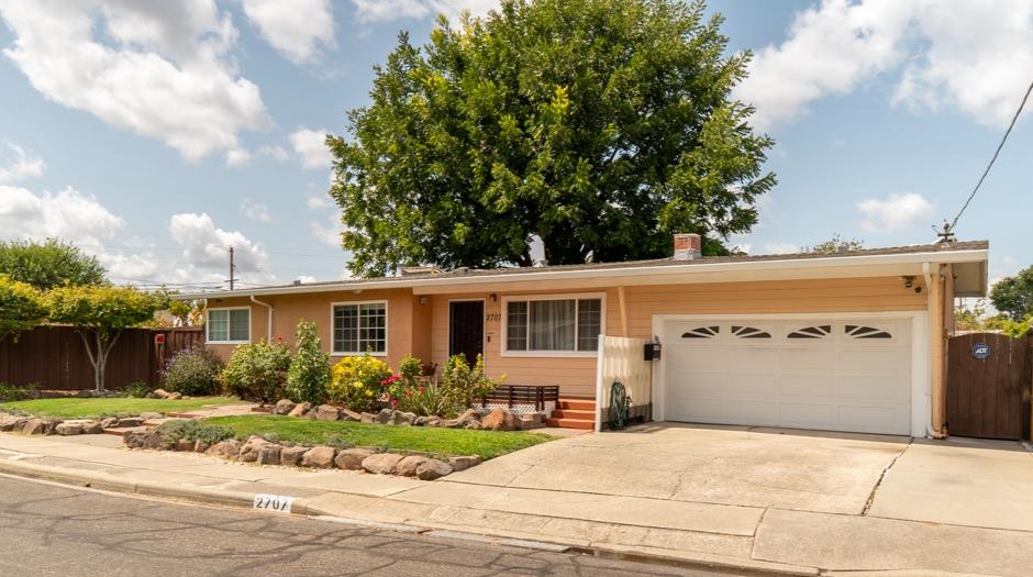 a front view of a house with yard