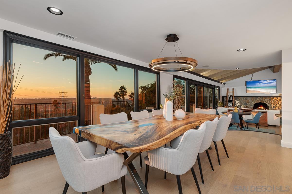 a view of a dining room with furniture window and outside view