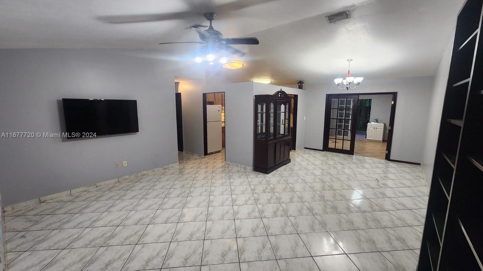 a view of a livingroom with a flat screen tv