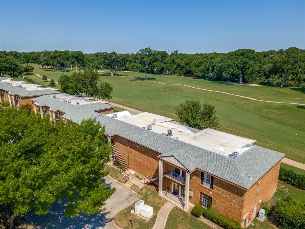 an aerial view of a house with a yard lake view and mountain view