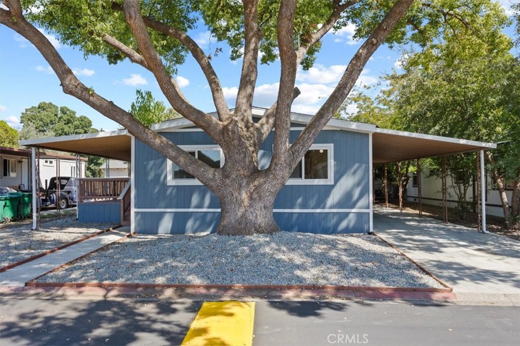 a house with a trees in the background