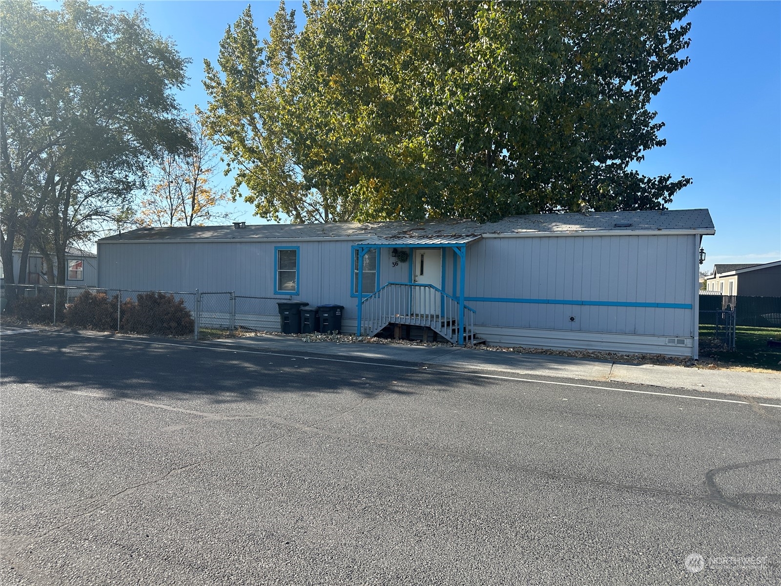 a view of a house with a yard and garage