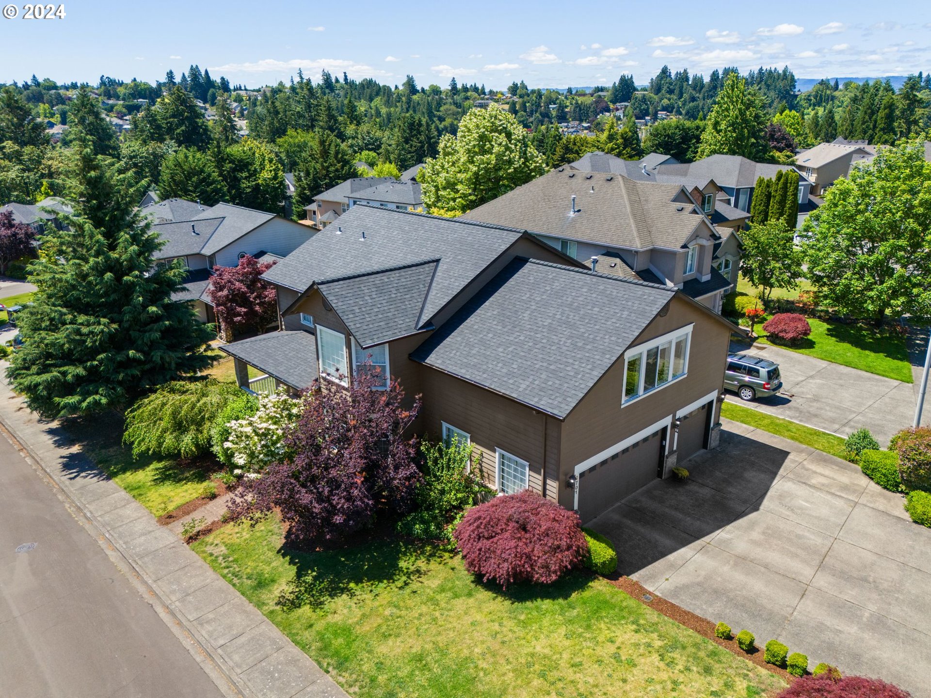 an aerial view of a house with a garden