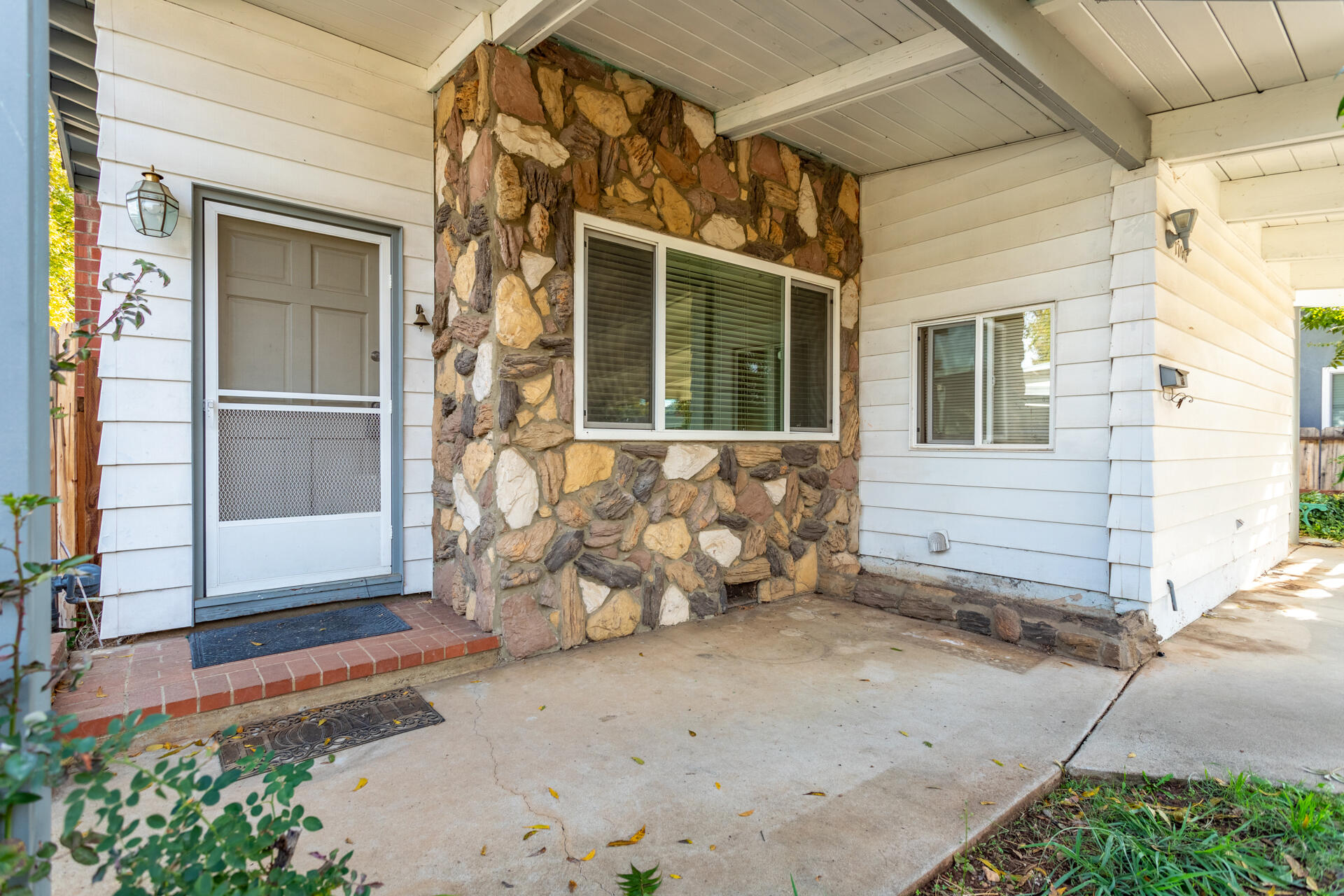 a view of a house with a door and wooden floor