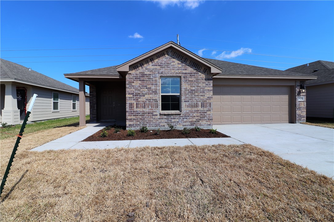 a front view of a house with yard