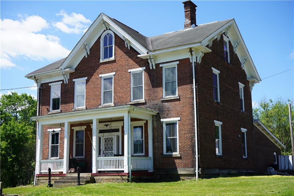 a front view of building with yard