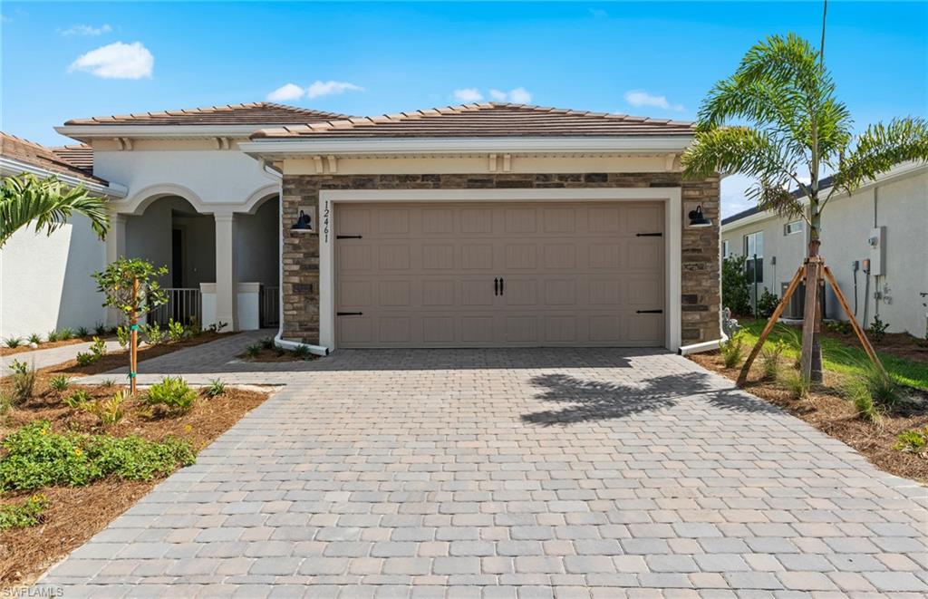 View of front facade featuring a garage