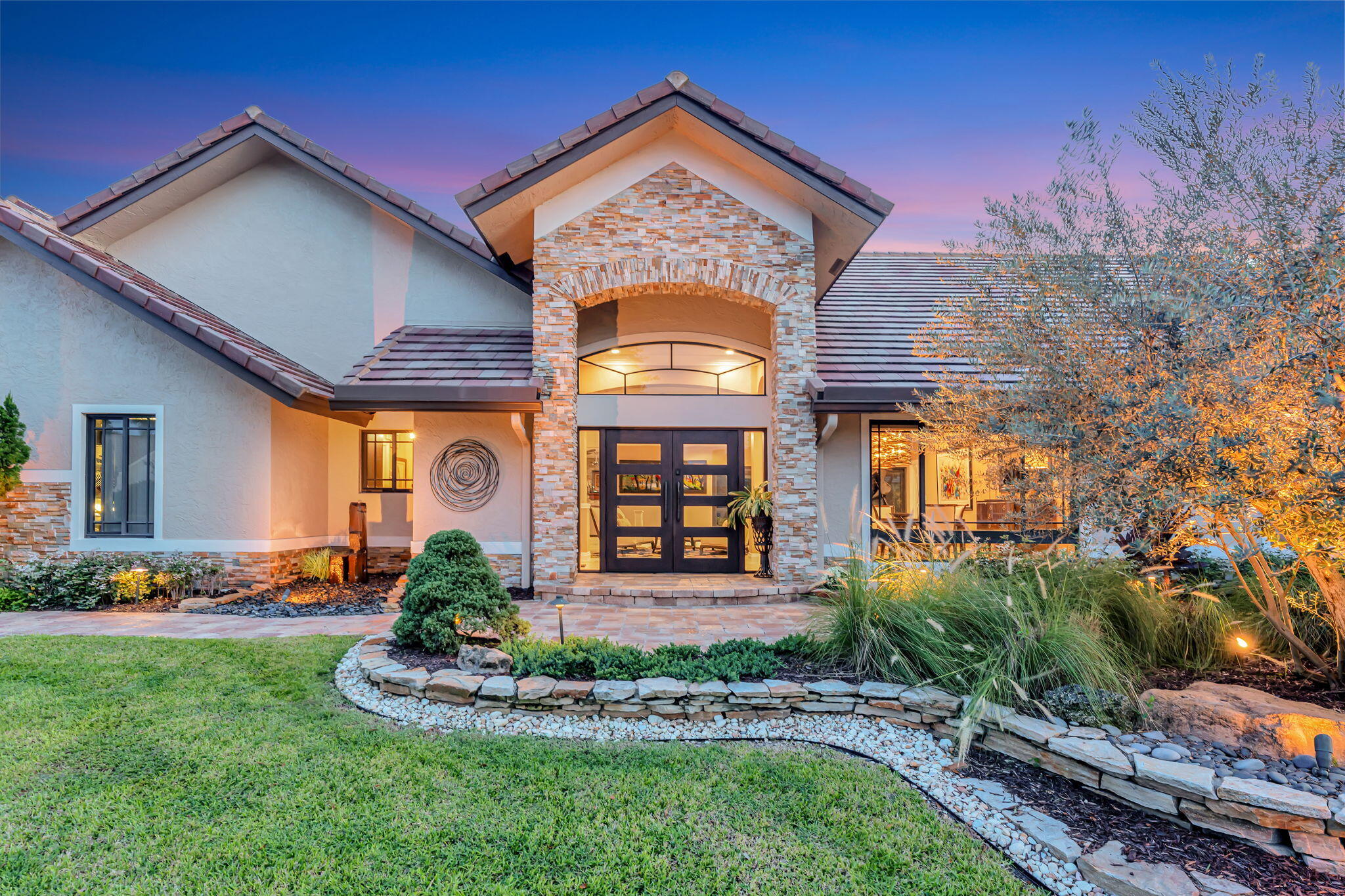 a front view of a house with a yard