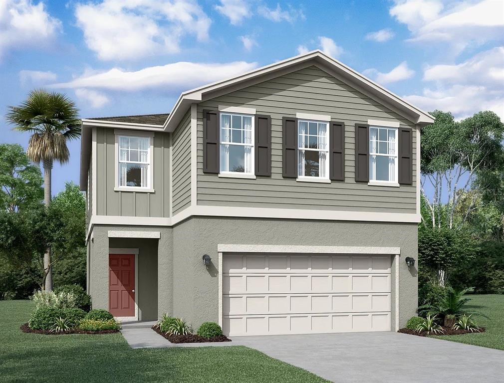 a front view of a house with a yard and garage