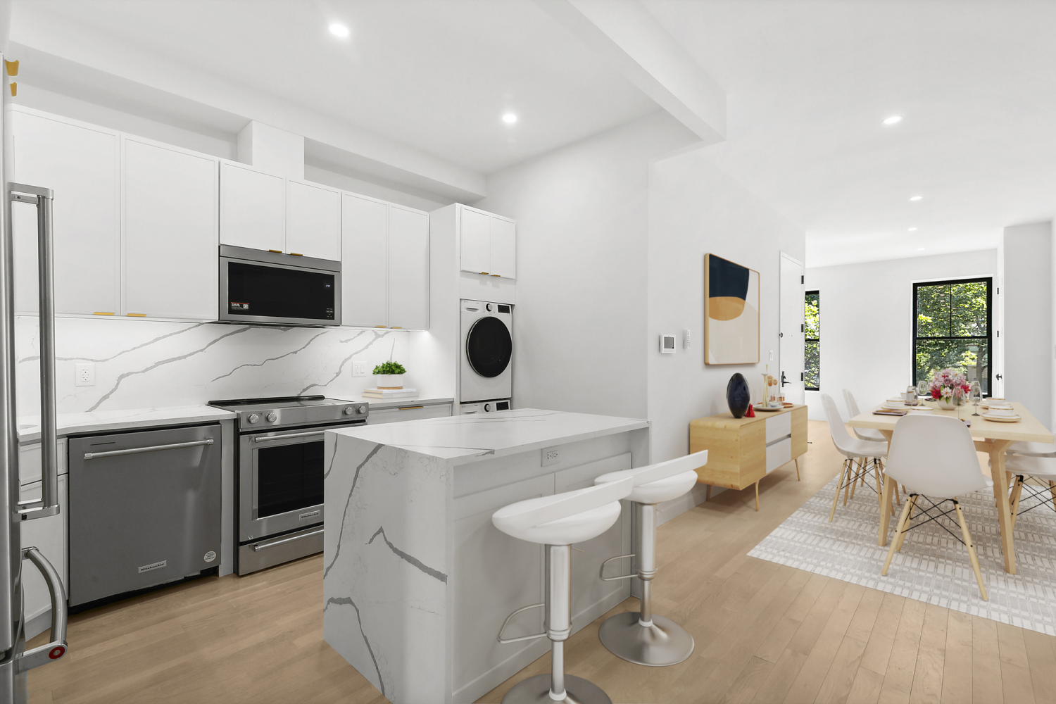 a kitchen with stainless steel appliances kitchen island granite countertop a sink and stove