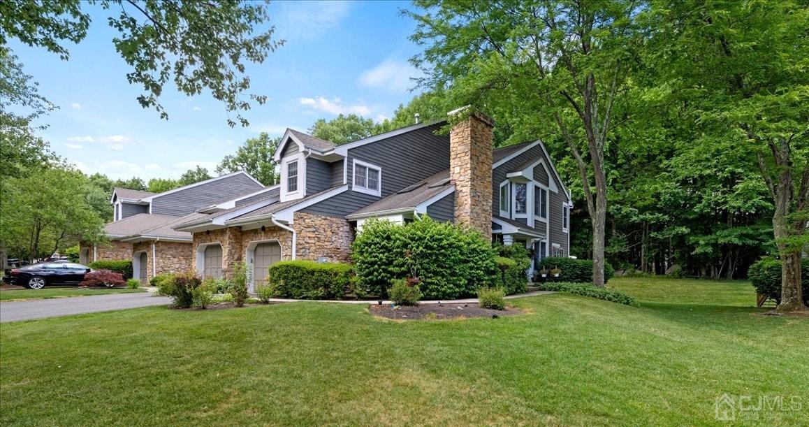 a front view of a house with a yard