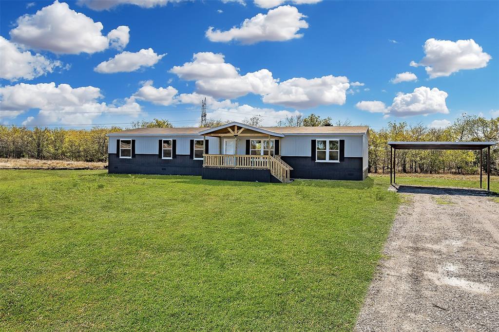 a view of a house with a big yard