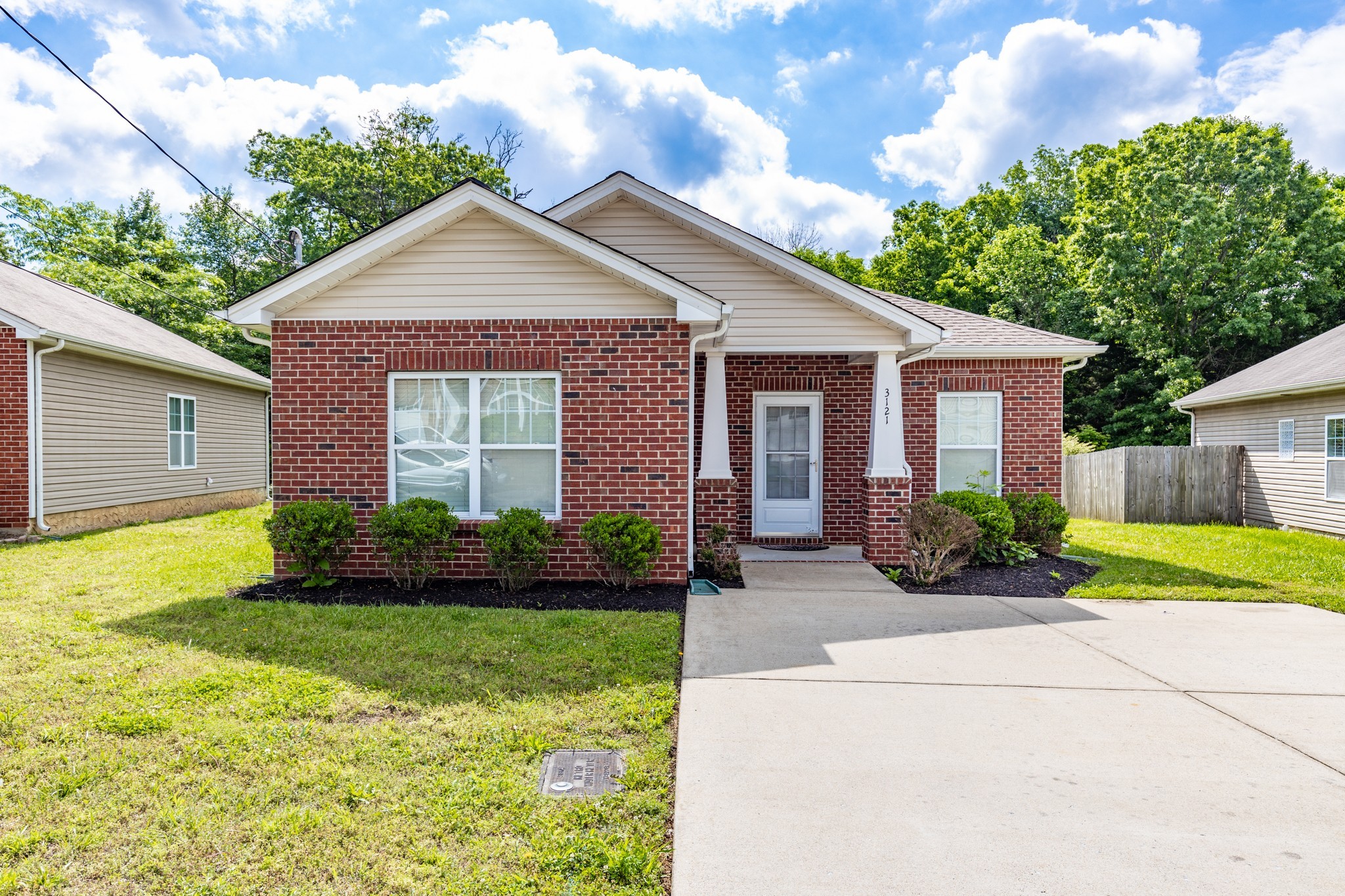 a front view of a house with a yard