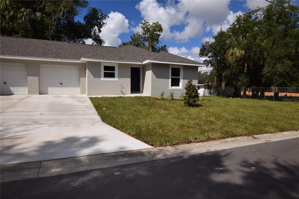 front view of a house with a patio