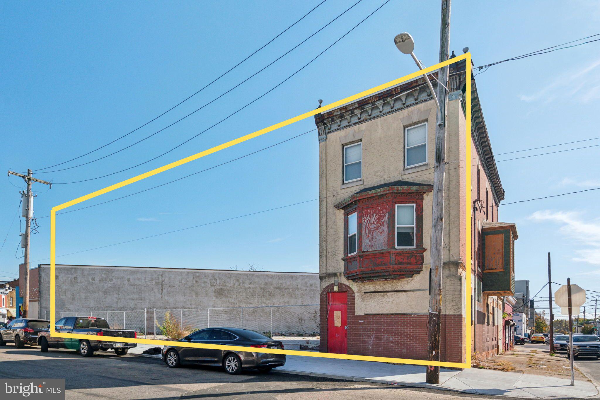 a front view of a building with street view