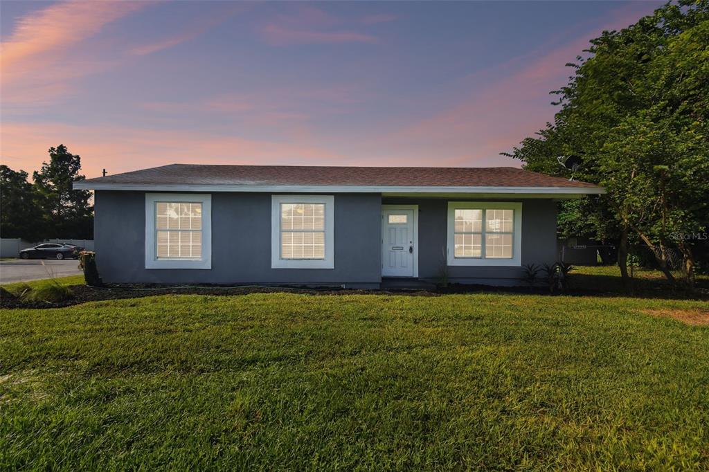 a view of a house with a yard