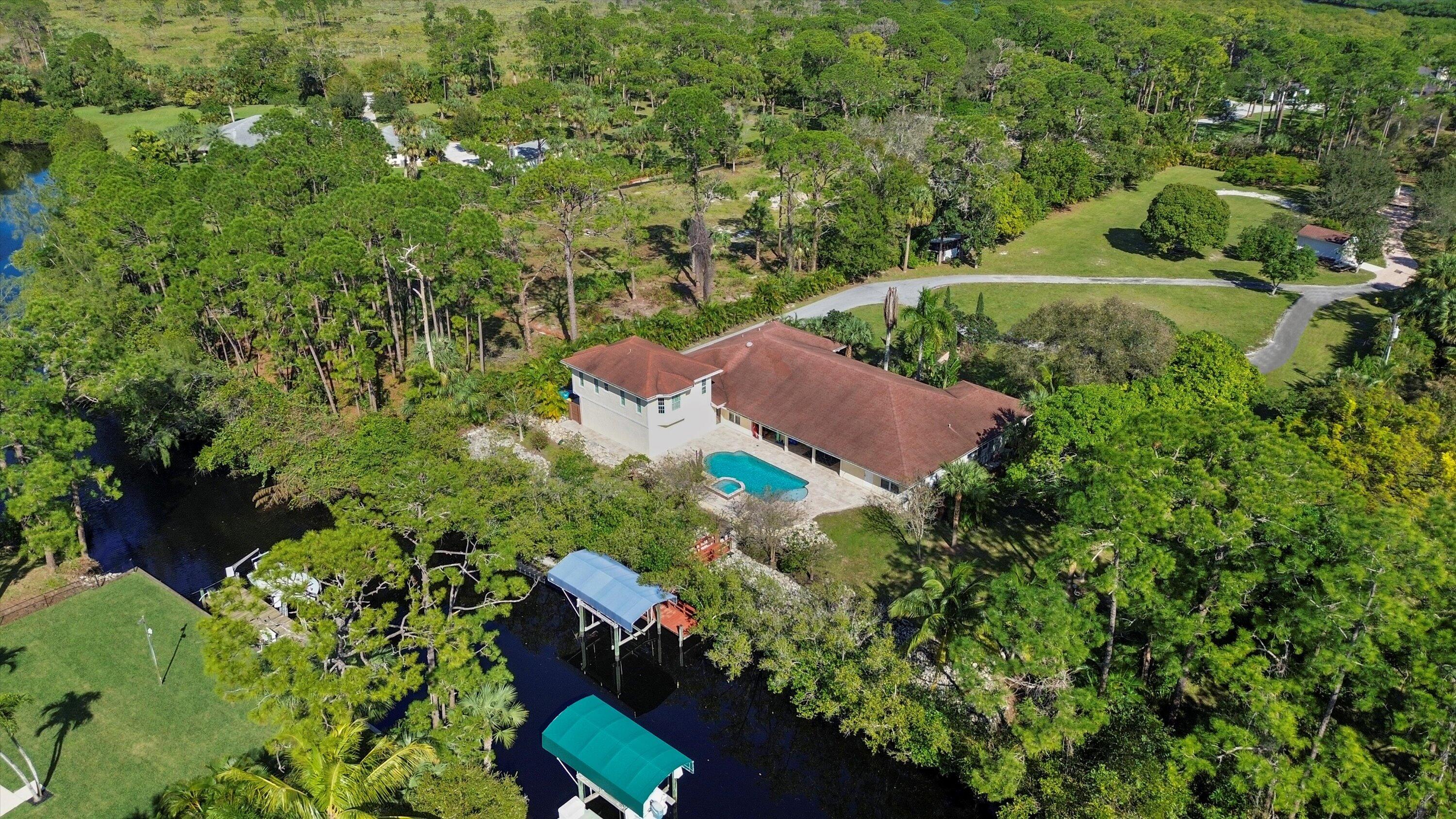 an aerial view of a house with yard