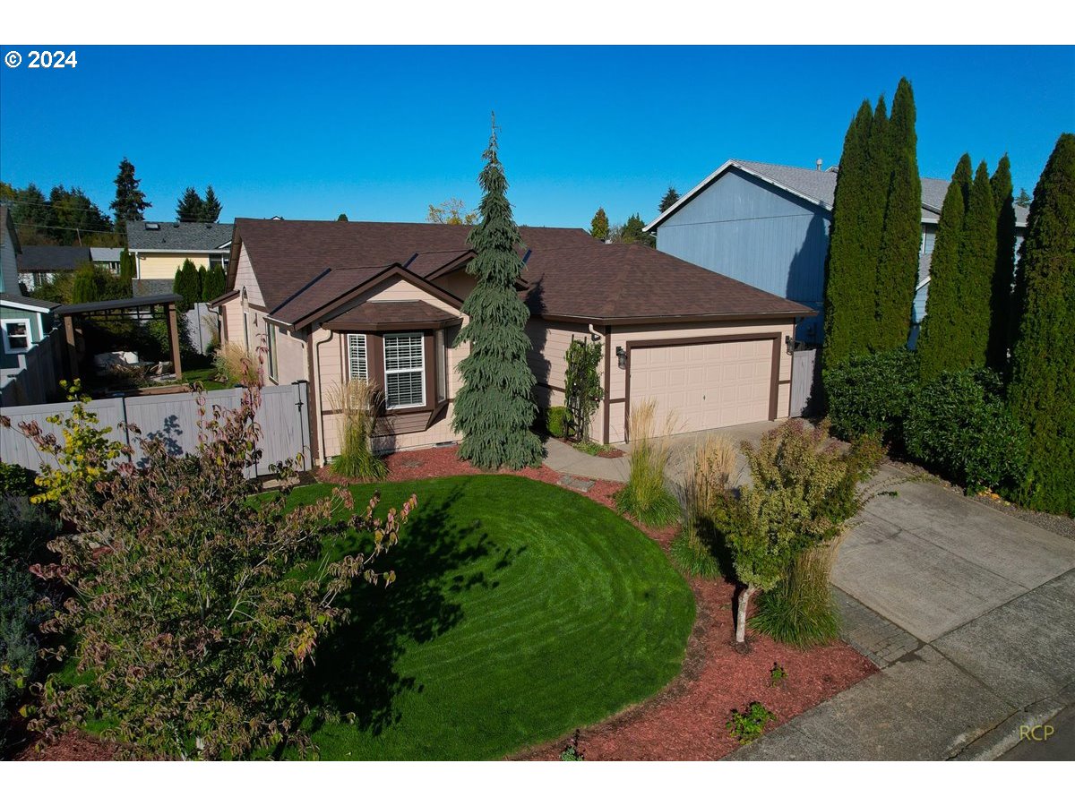 a front view of a house with garden