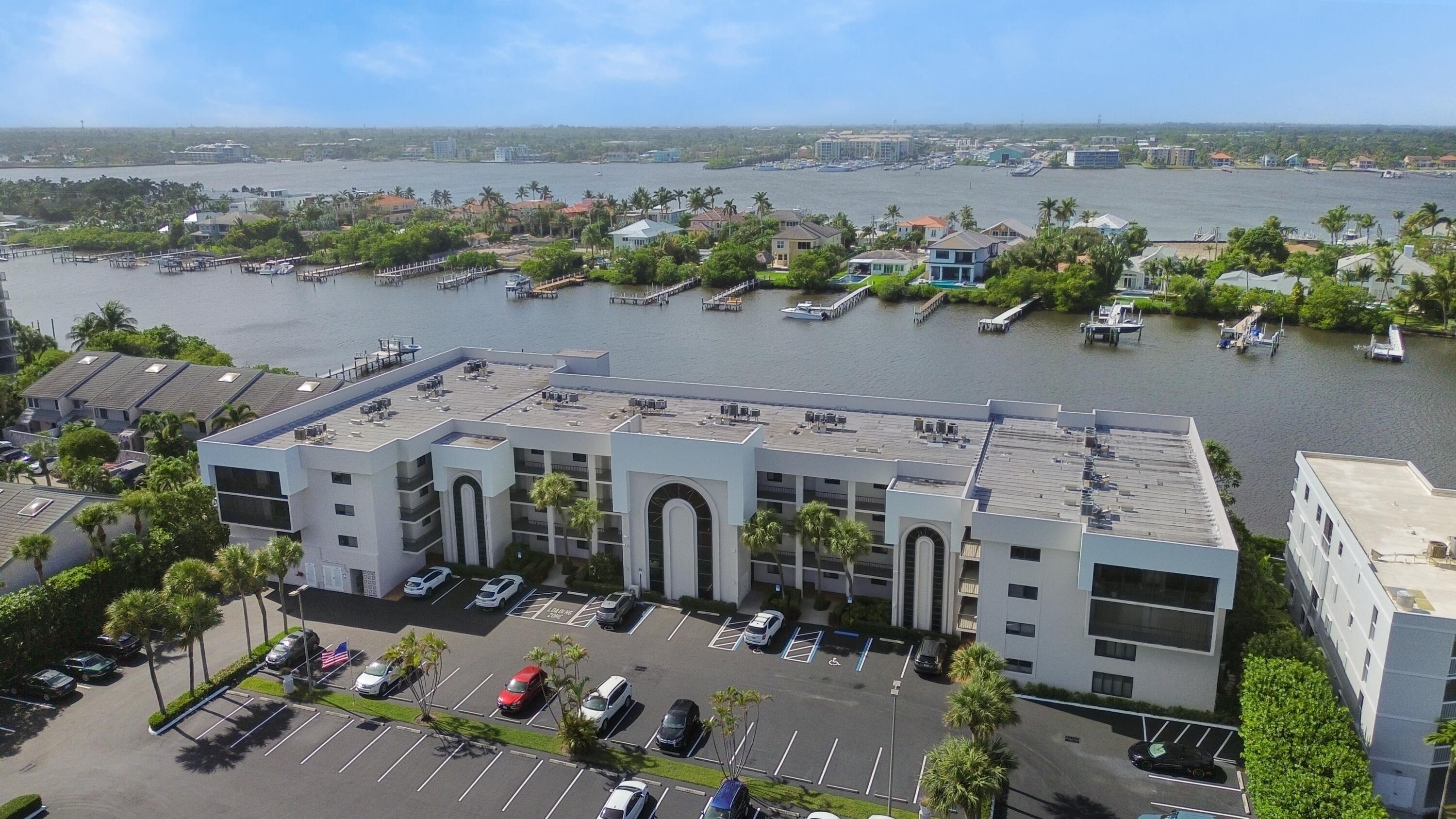 an aerial view of a house with a lake view